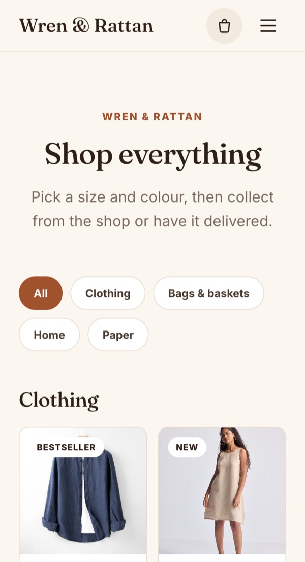 The Wren & Rattan shop on a phone